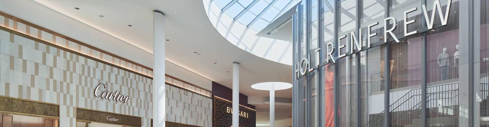 Yorkdale mall corridor with Cartier, Bvlgari, and Holt Renfrew storefronts