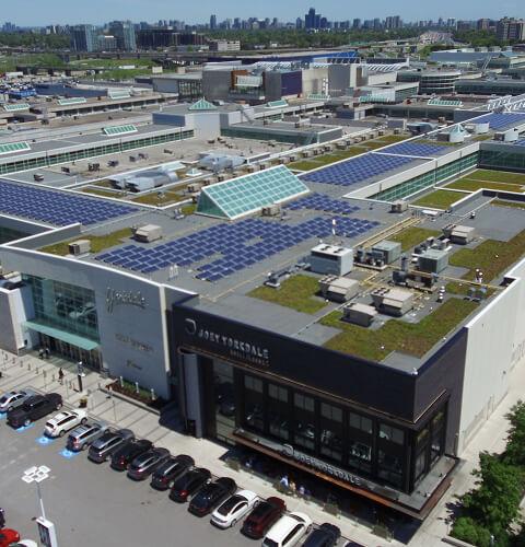 Aerial view of Yorkdale rooftop with solar panels and green roof beside Joey Yorkdale