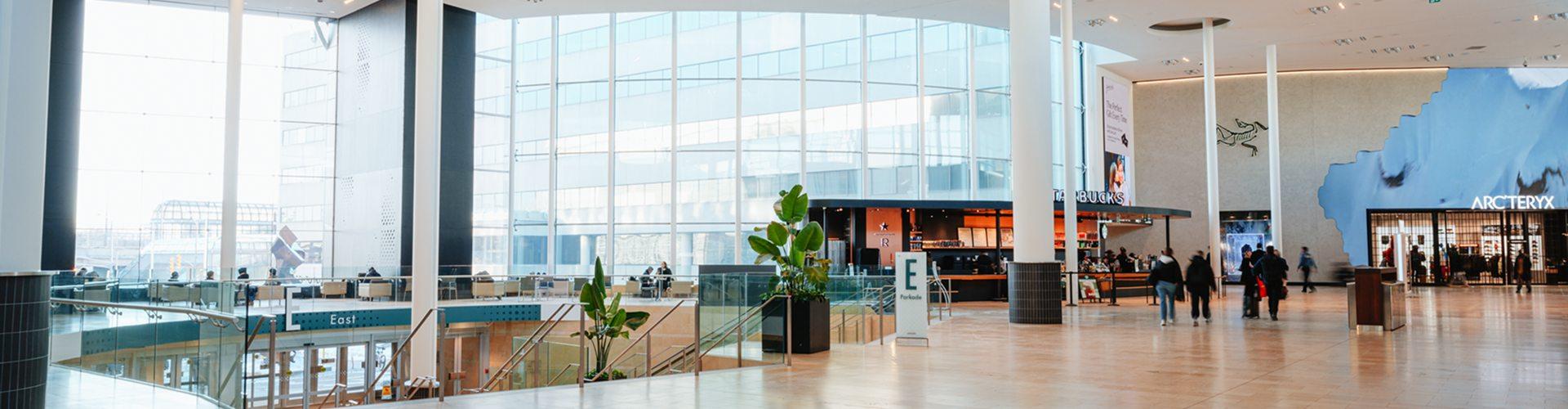 Plan your visit to a bright Yorkdale shopping mall with stores, seating areas and upper-level walkways