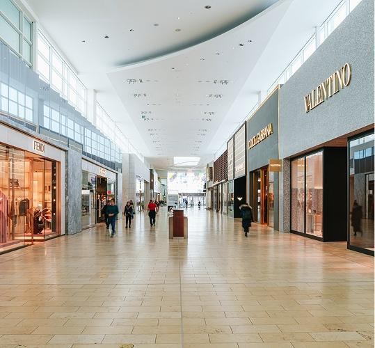Yorkdale mall luxury shopping corridor with designer storefronts and visitors