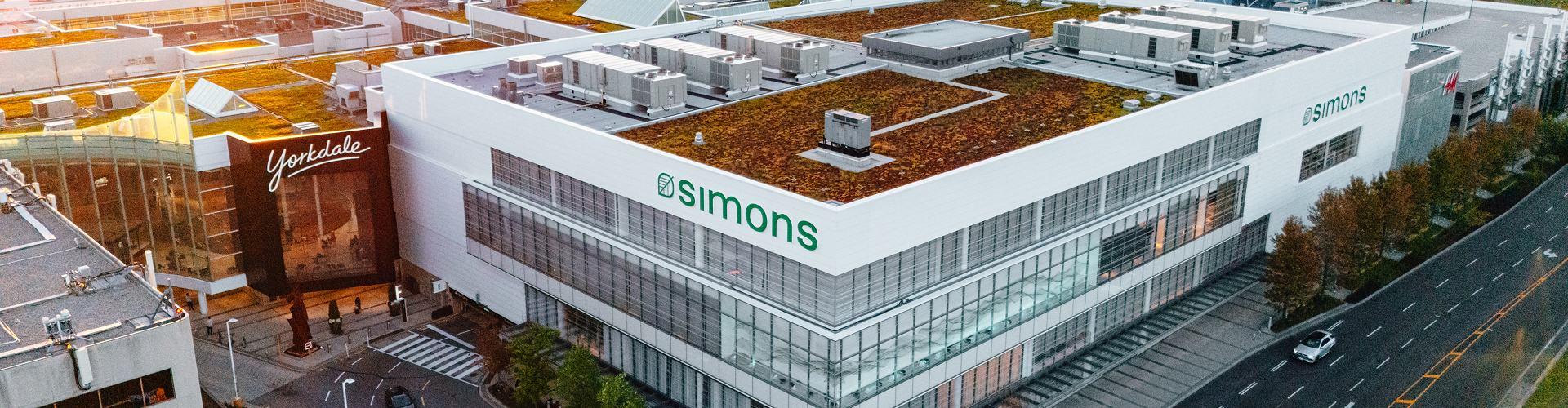 Aerial view of Simons store with green rooftop beside Yorkdale Shopping Centre