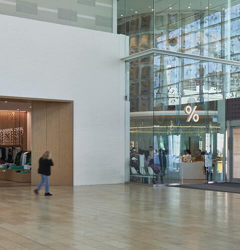 Alo Yoga storefront with mannequins in activewear near the South West entrance