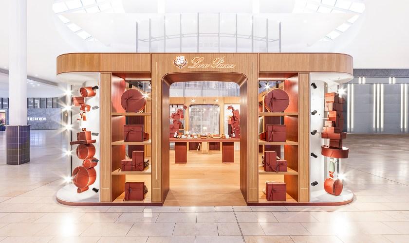 Loro Piana pop-up kiosk with stacked orange hatboxes and gifts in Yorkdale mall