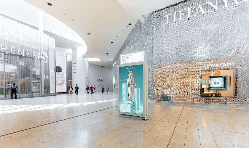 Tiffany and Co store with silver mesh facade and digital ad display in Yorkdale