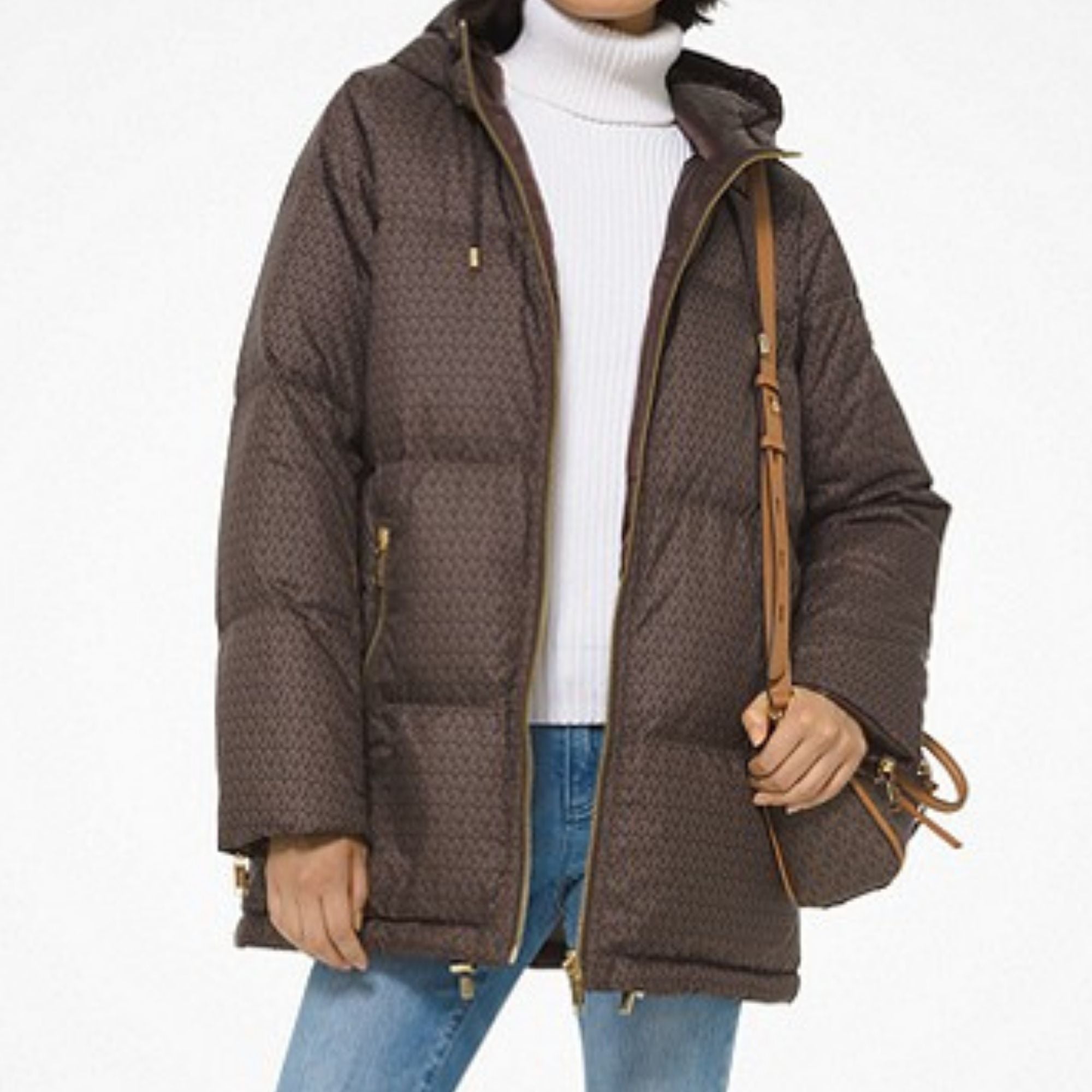 Brown puffer coat with handbag over shoulder