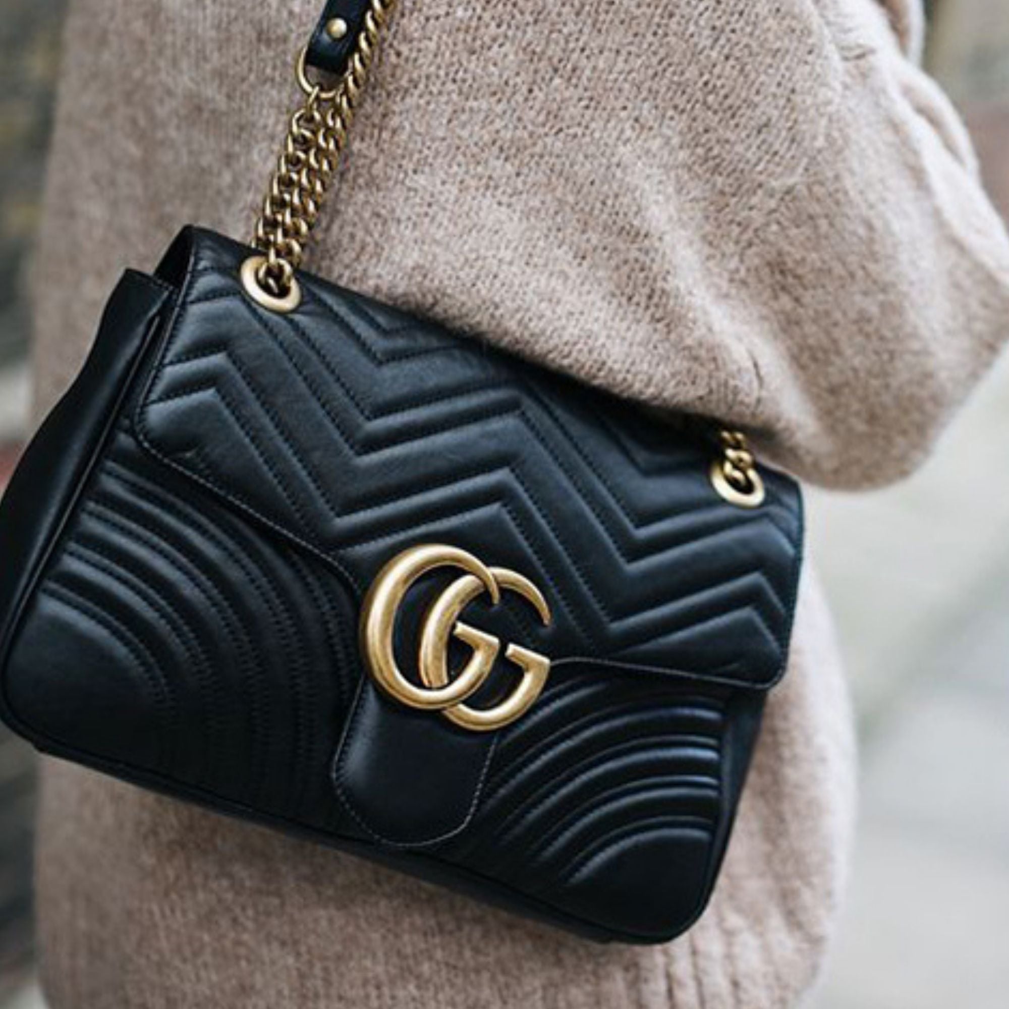 Black Gucci bag with gold hardware