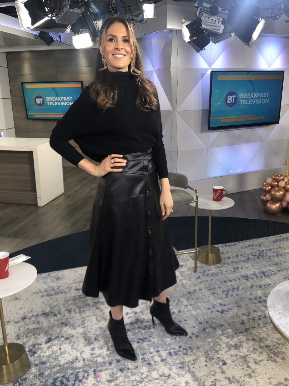 Dina wearing black leather skirt with black long sleeve
