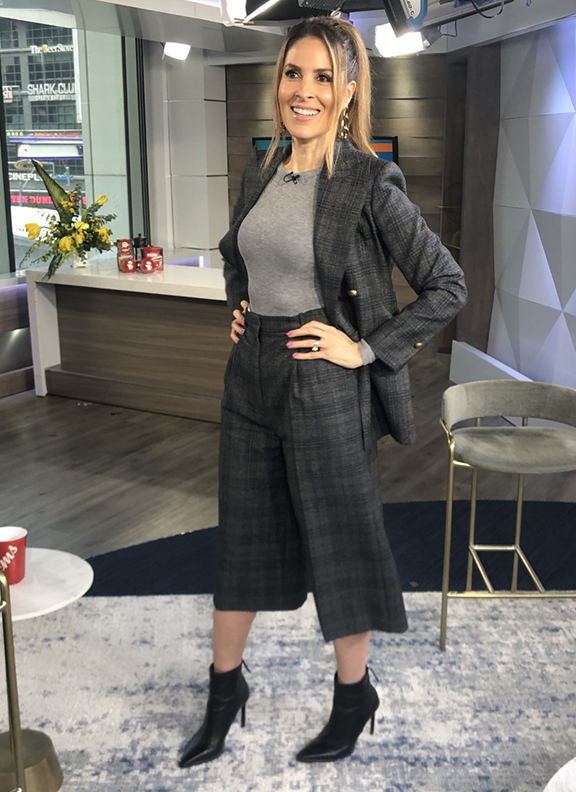 Dina wearing patterned blazer and knee length pants with black booties - 2