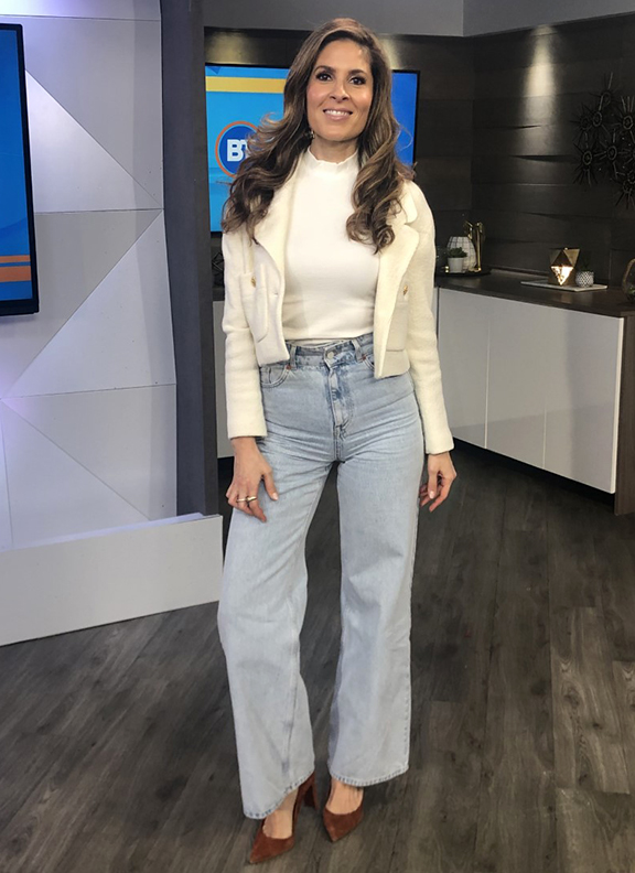 Dina wearing white top and jacket paired with light jeans bell bottoms - 2