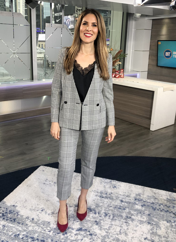 Dina wearing black and white pattern blazer and pantsuit with black cami - 2