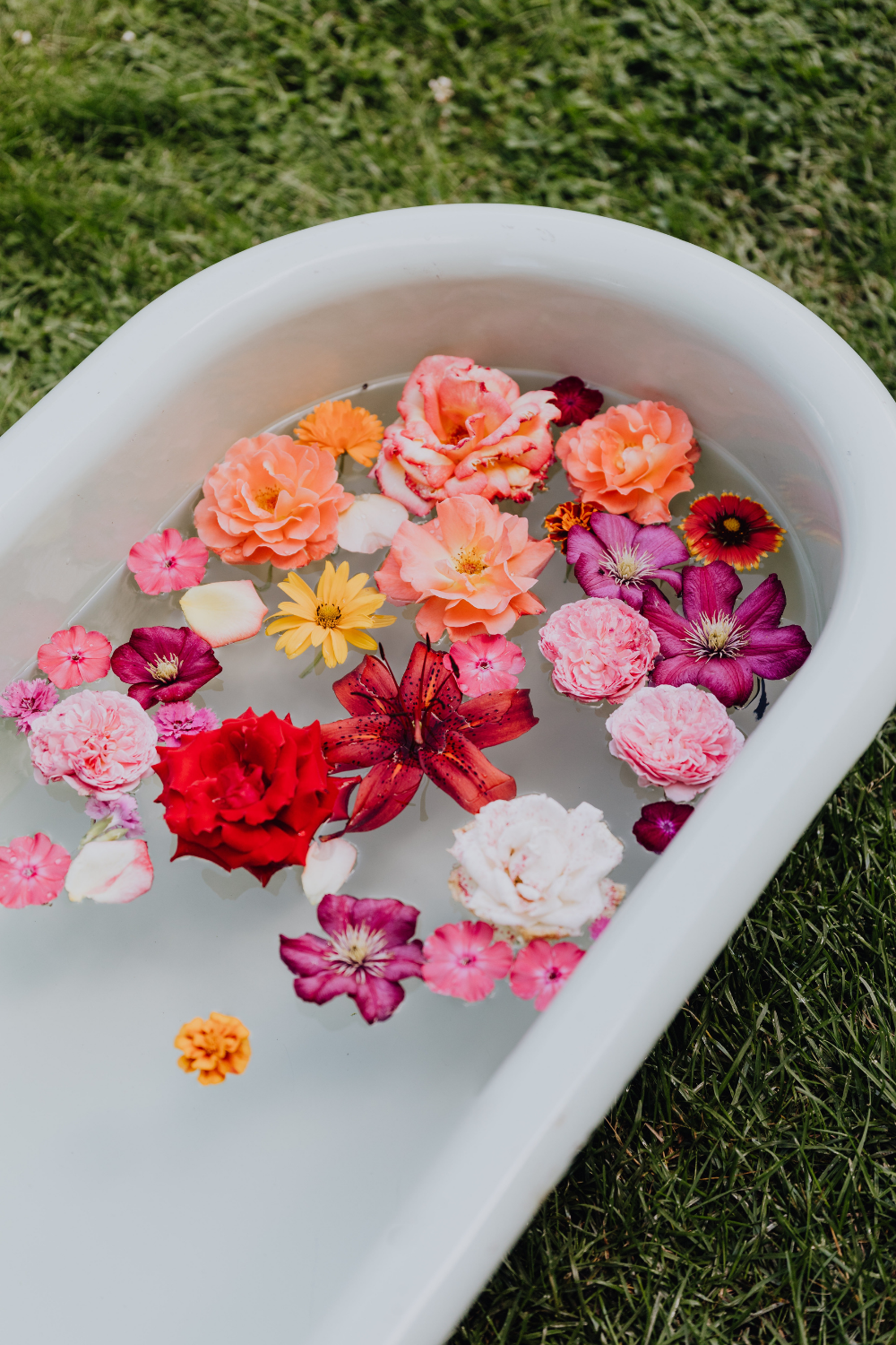 Bathtub filled with floating flowers