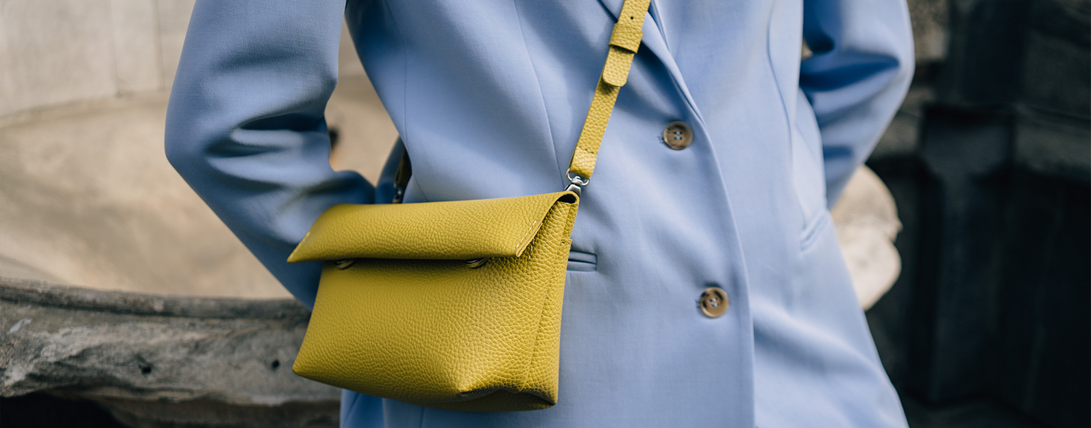 Blue blazer with yellow bag