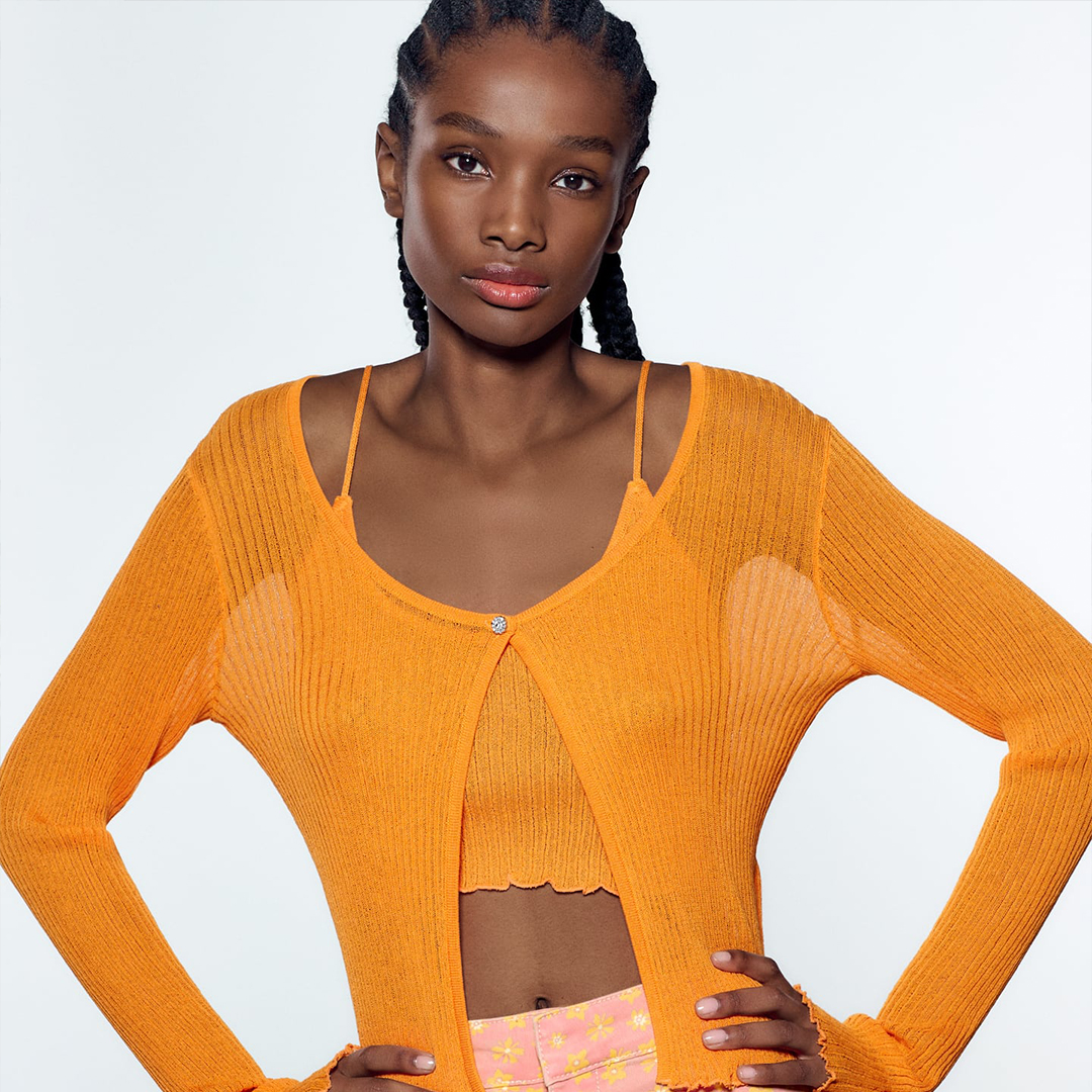model in orange shirt