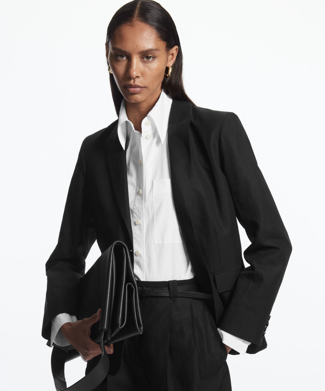 woman wearing black cos blazer