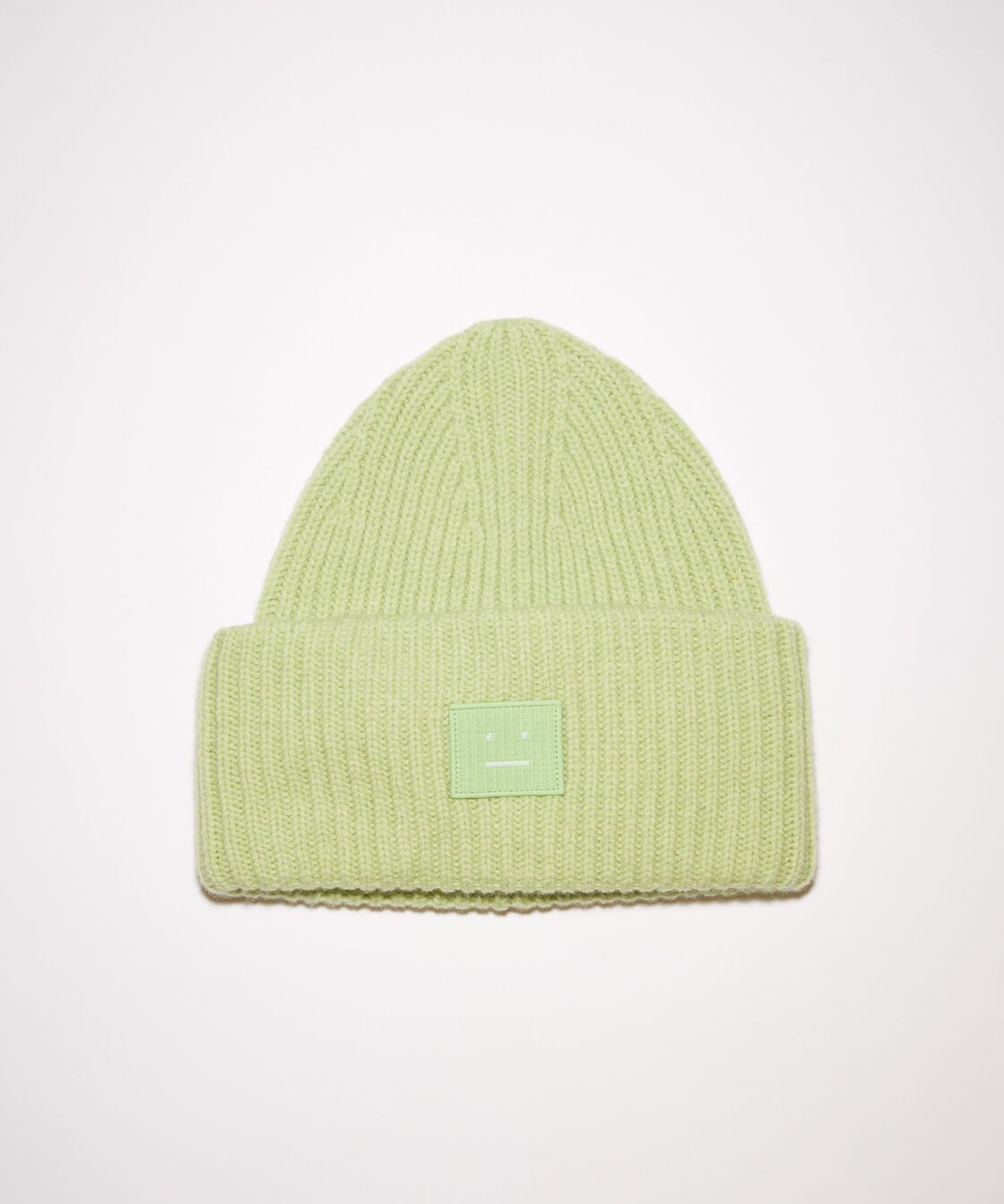 Acne Studios pale green melange knit beanie featuring a large embroidered face logo pitch and ribbed detailing, crafted from chunky wool.