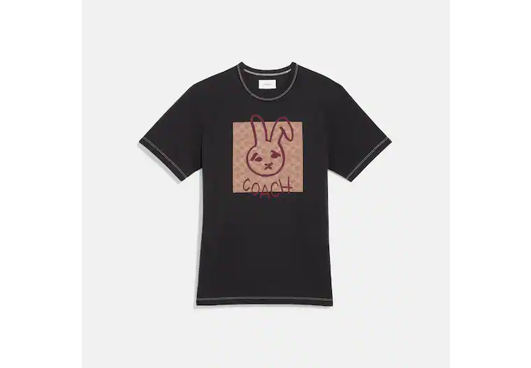 Image of a black Coach t-shirt with a bunny illustration on the front.