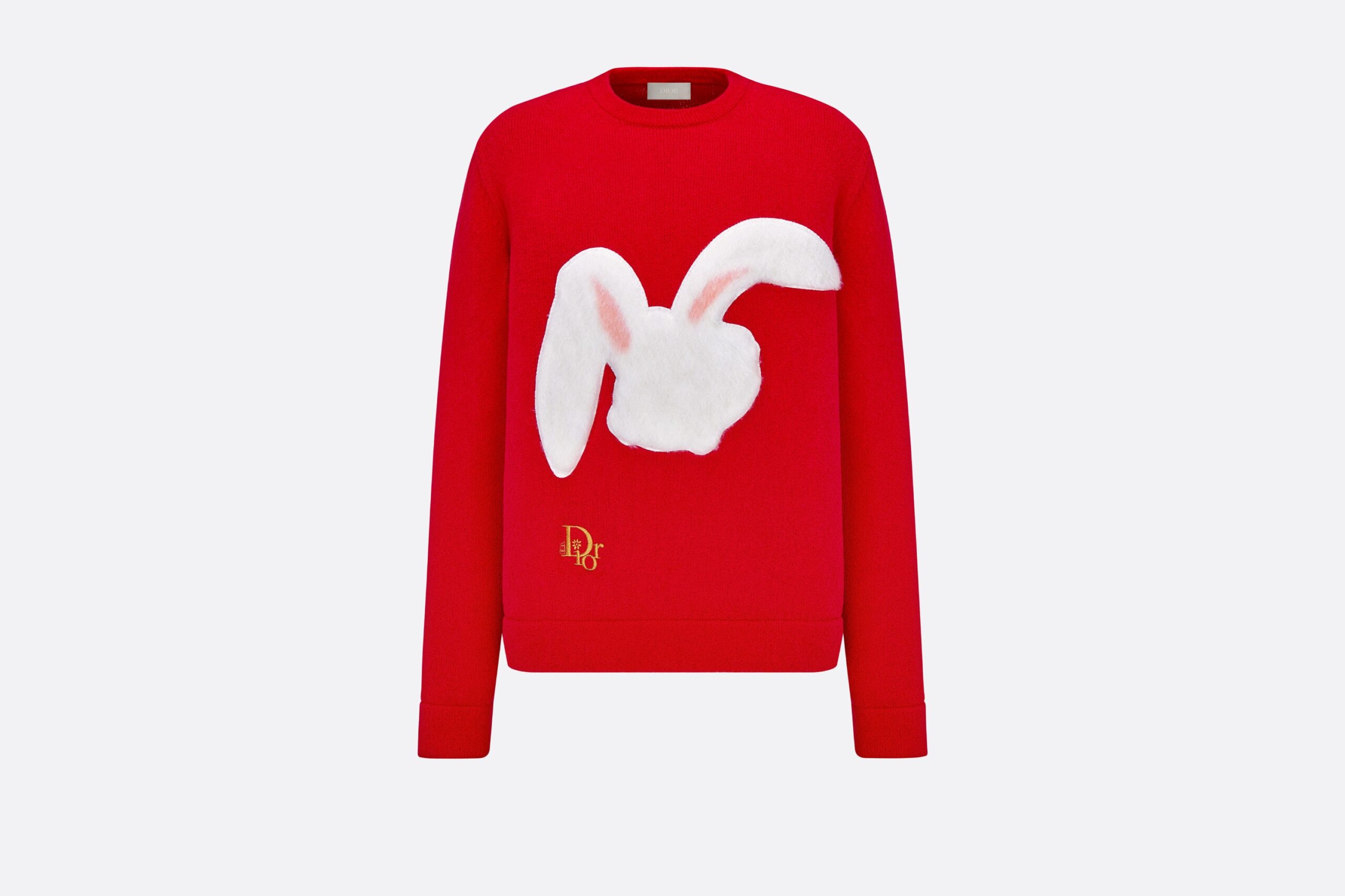 Image of a red Dior sweater with a white bunny head on the front.