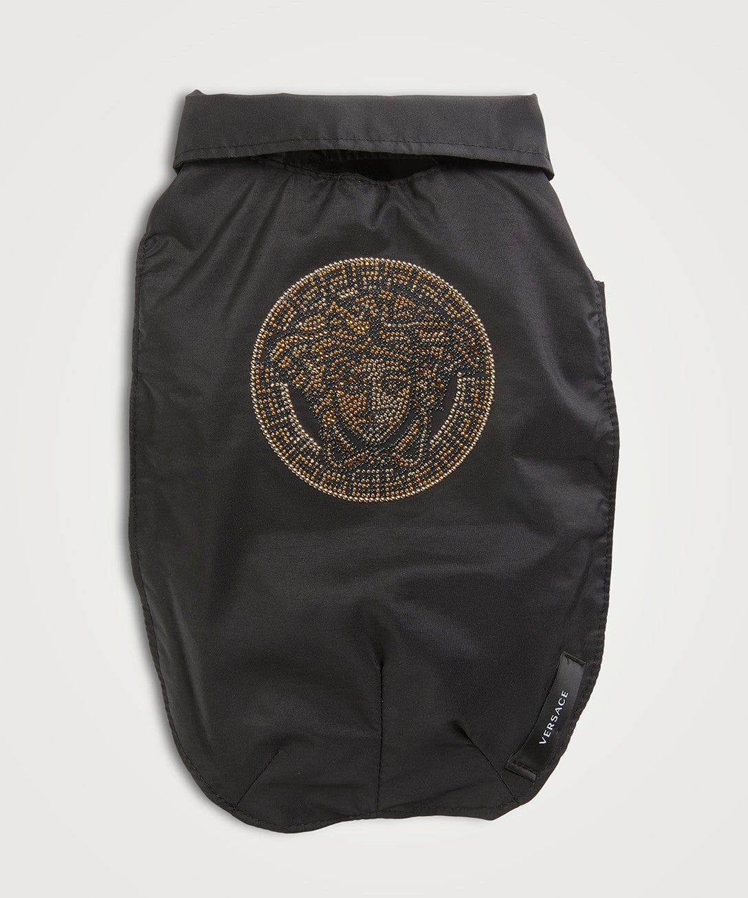 A black Versace dog coat with the Versace logo in gold on the back.