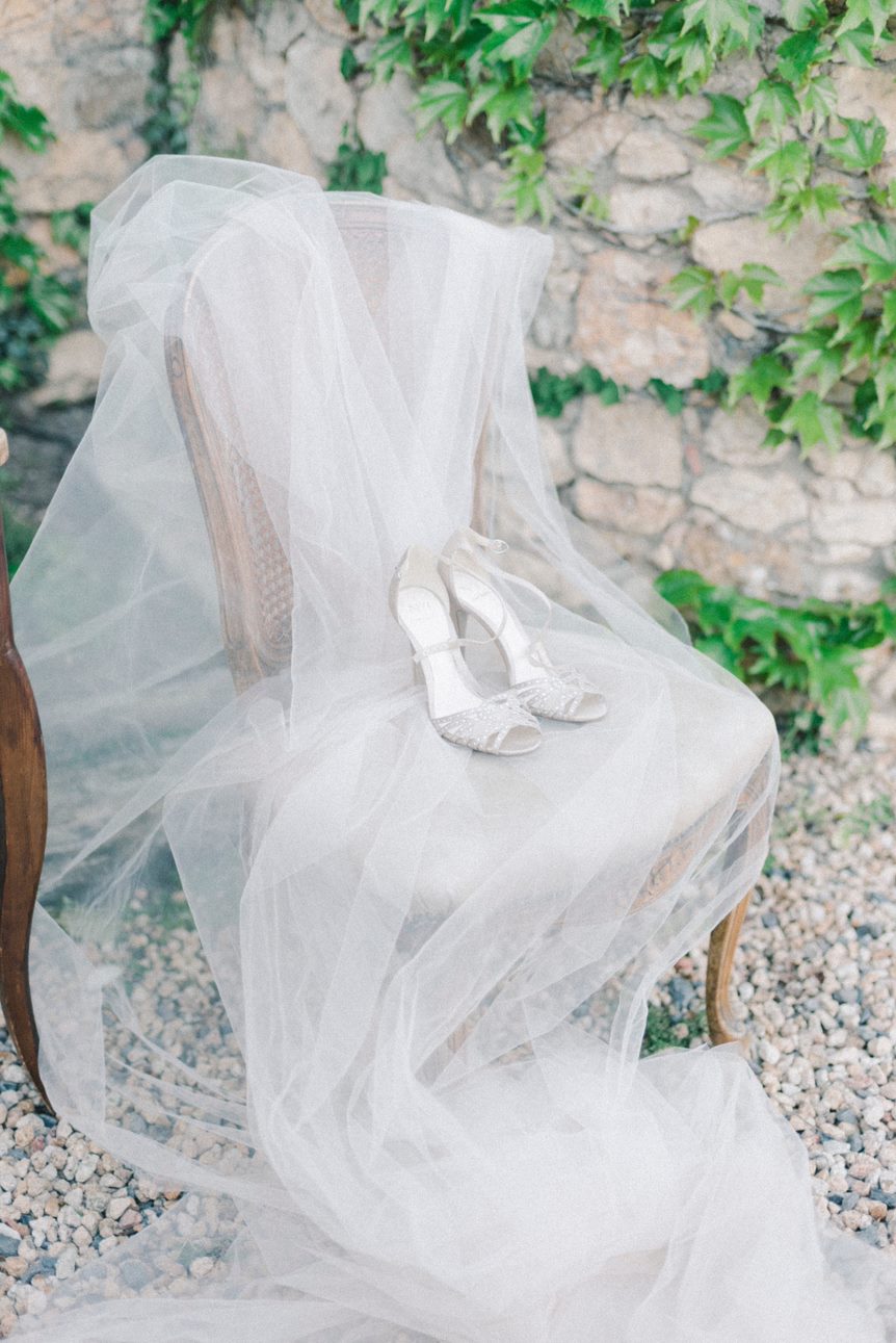 Sparkly heels on top of a white veil