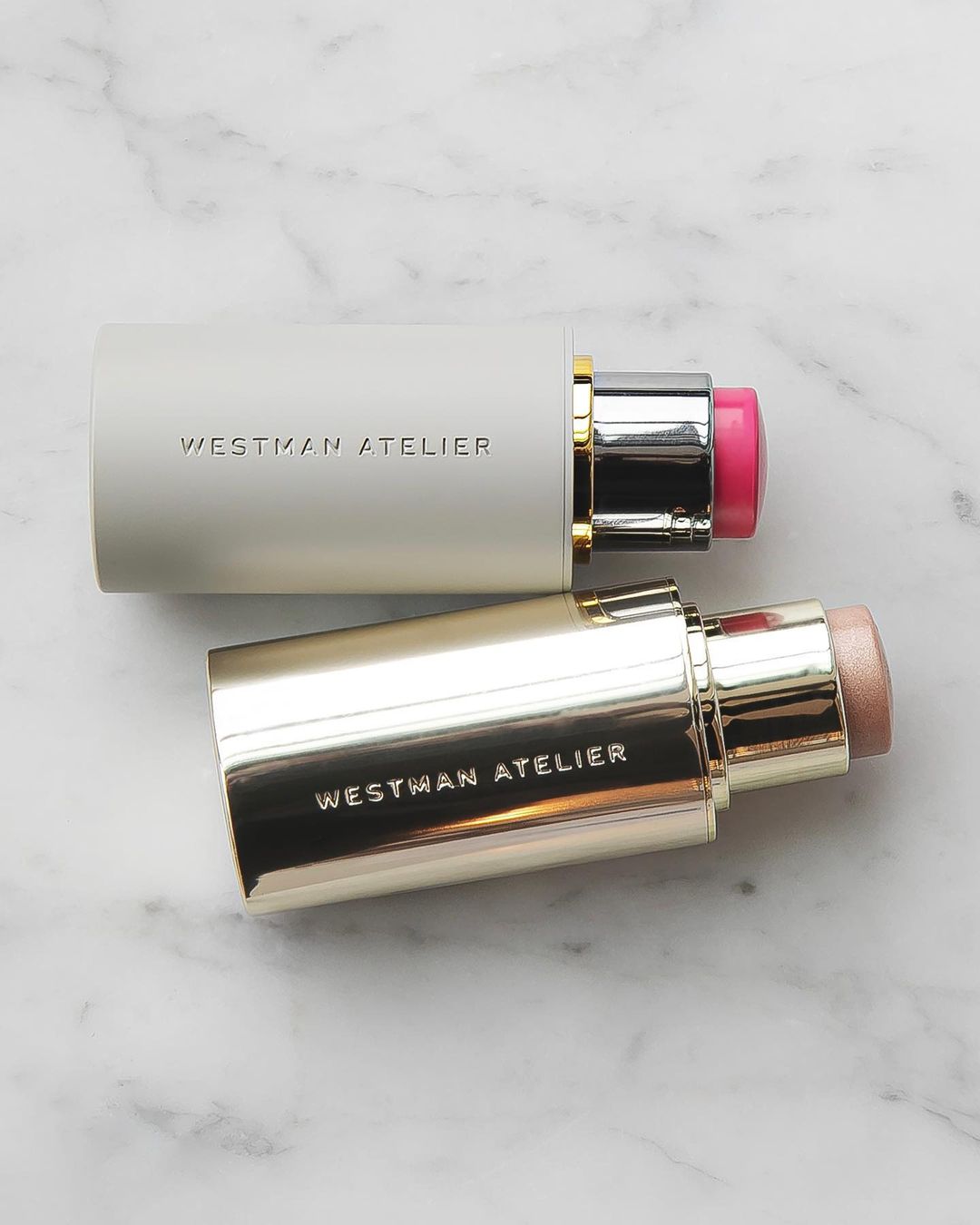 image of two westman atelier blush sticks on a marble tabletop