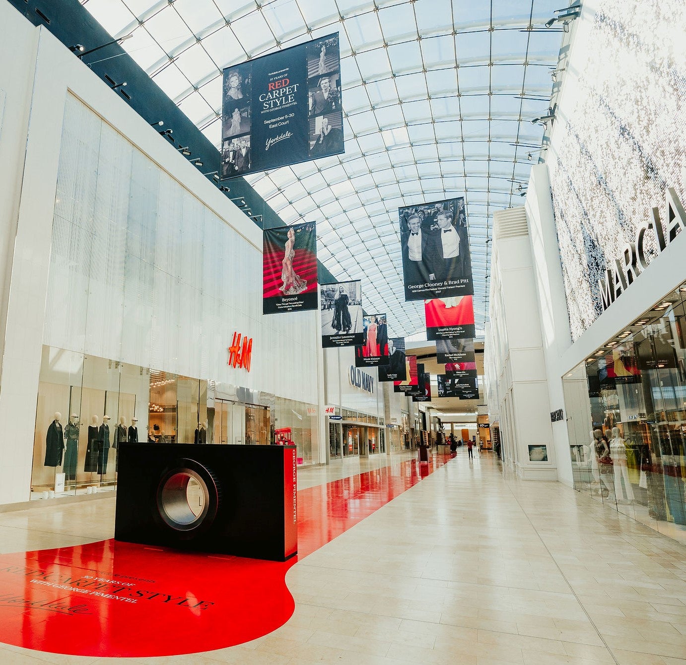 Yorkdale's atrium, housing George Pimentel's photography work. Hung from the ceiling.