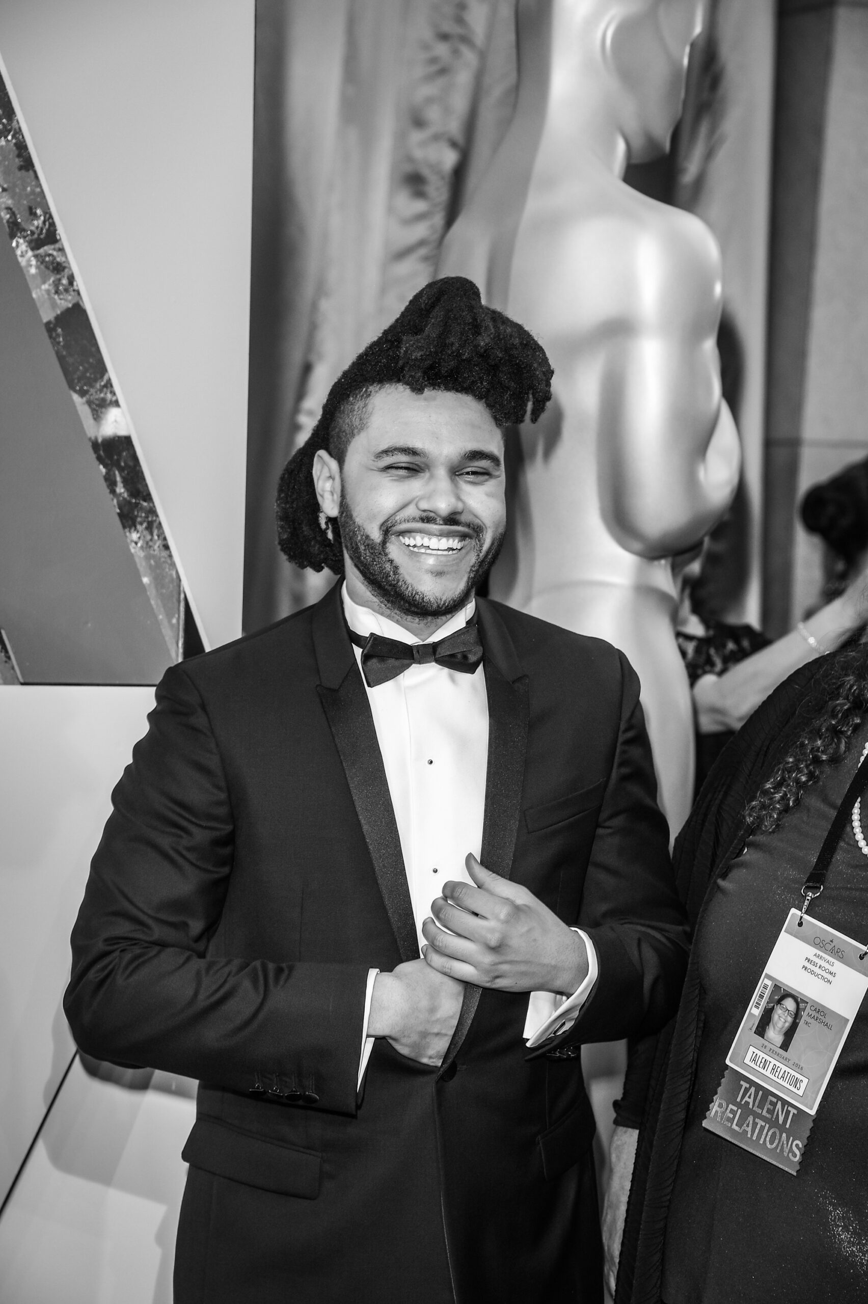 The Weeknd, in a black tuxedo, photographed by George Pimentel, black and white image.