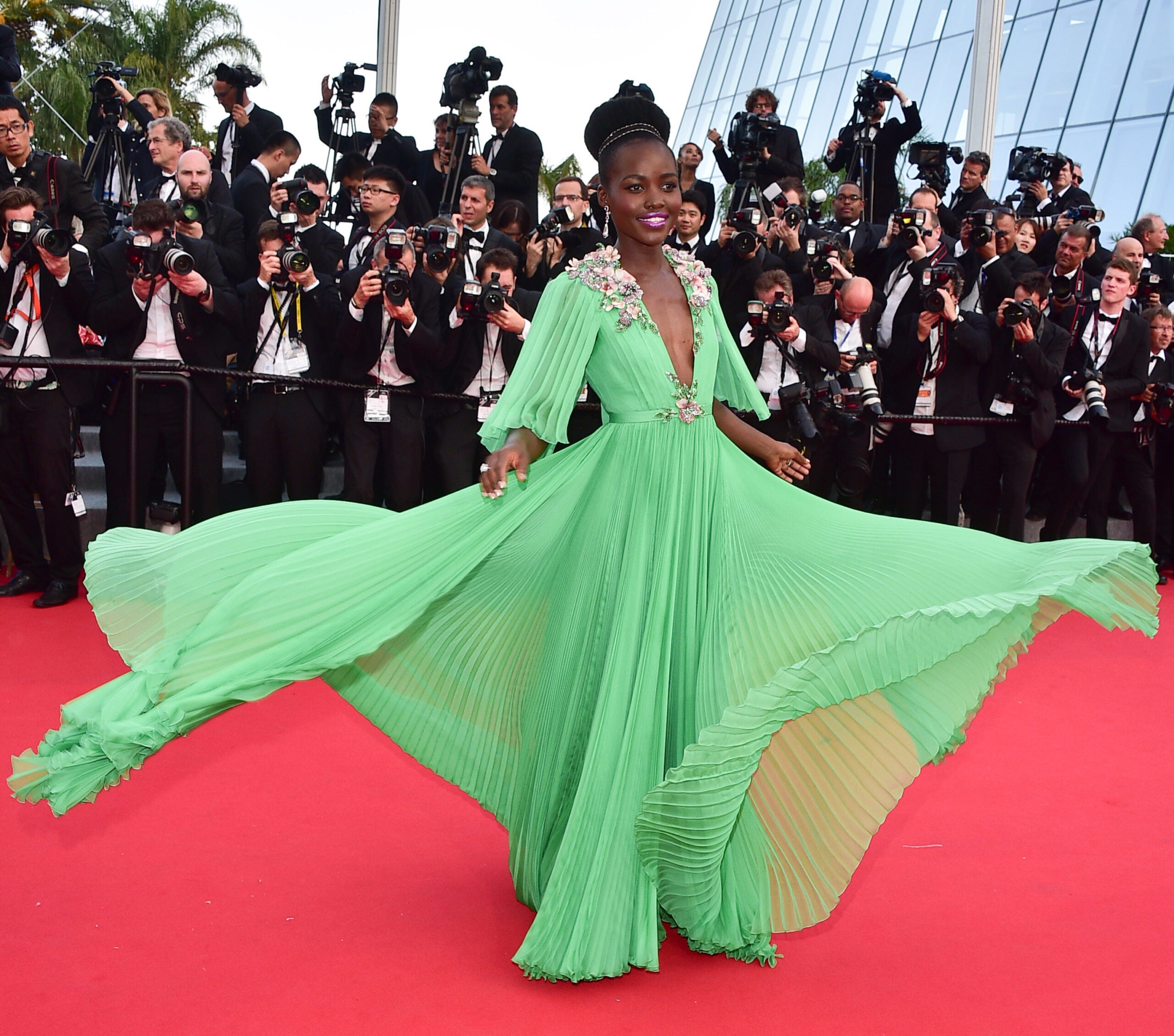 Lupita Nyong'o in a Gucci dress on the red carpet, Photographed by George Pimentel.