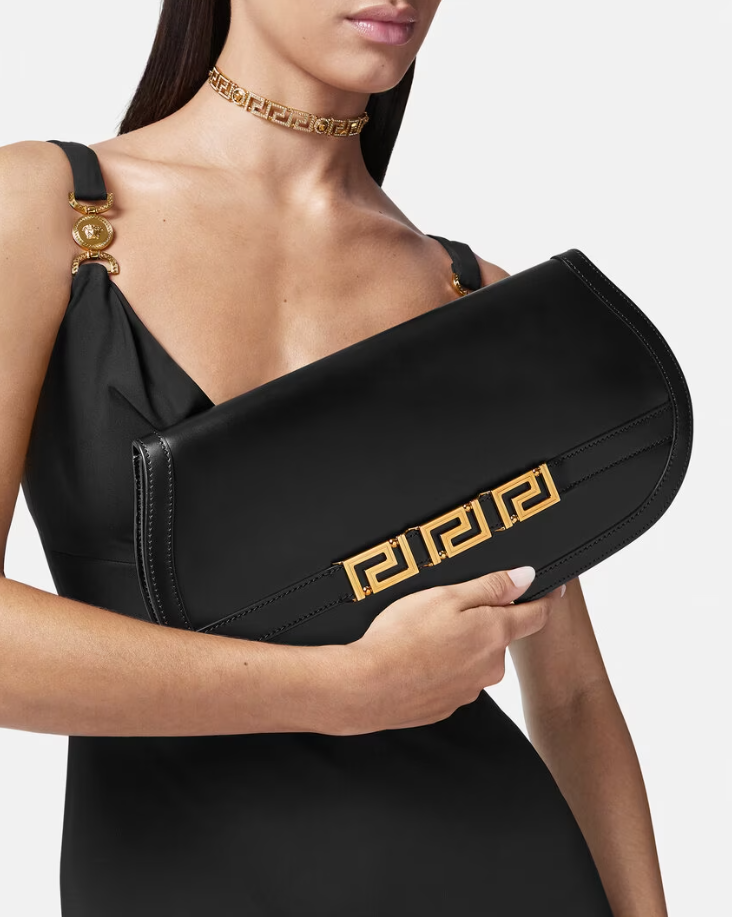Black Versace clutch with gold embroidery, shop now at Yorkdale Shopping Centre