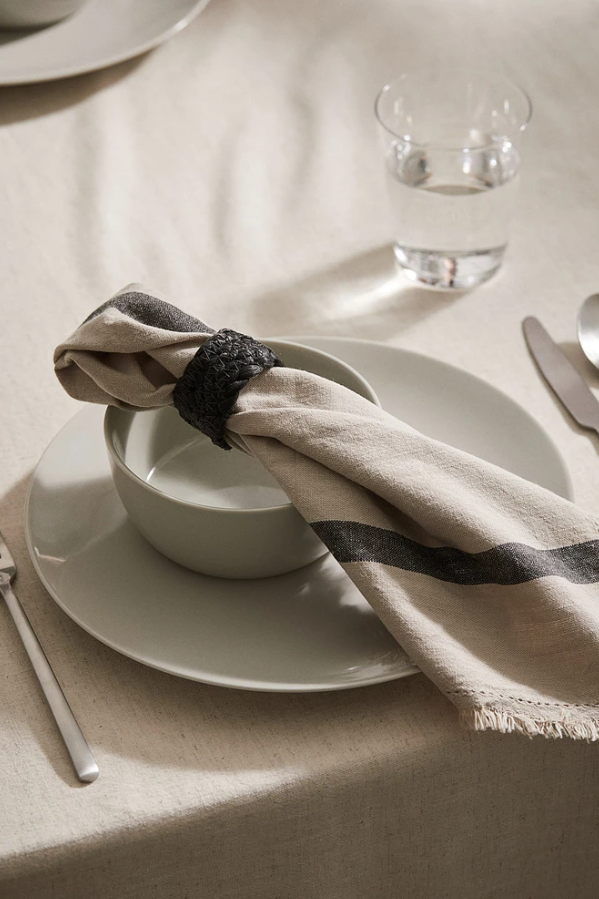 H&M; Thanksgiving table setting; white and grey napkin with porcelain plates; Yorkdale Shopping Centre; 2024