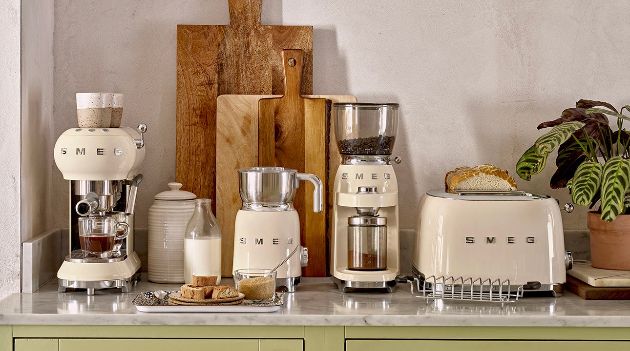 Smeg cream products on a counter top.