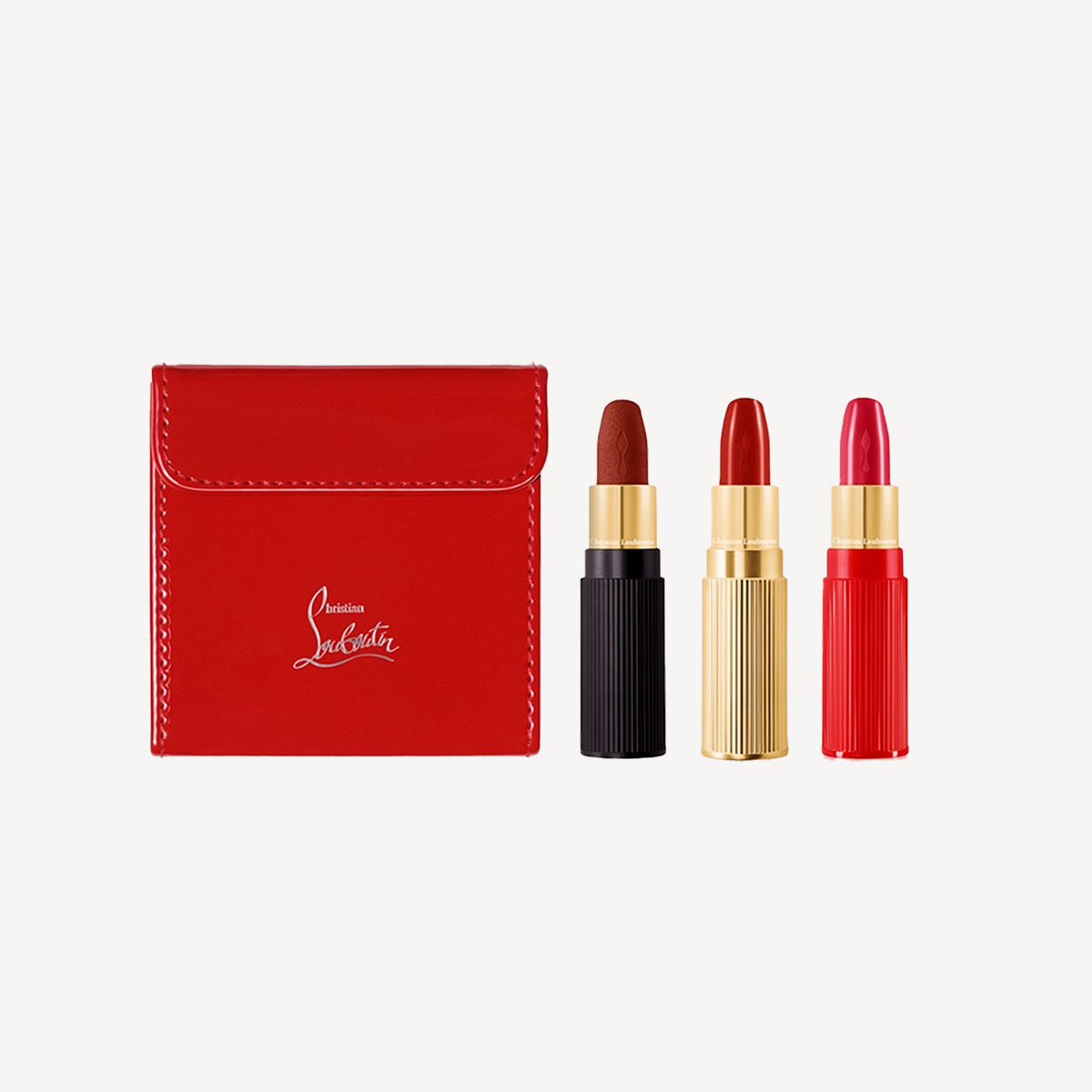 Three lipsticks with red box