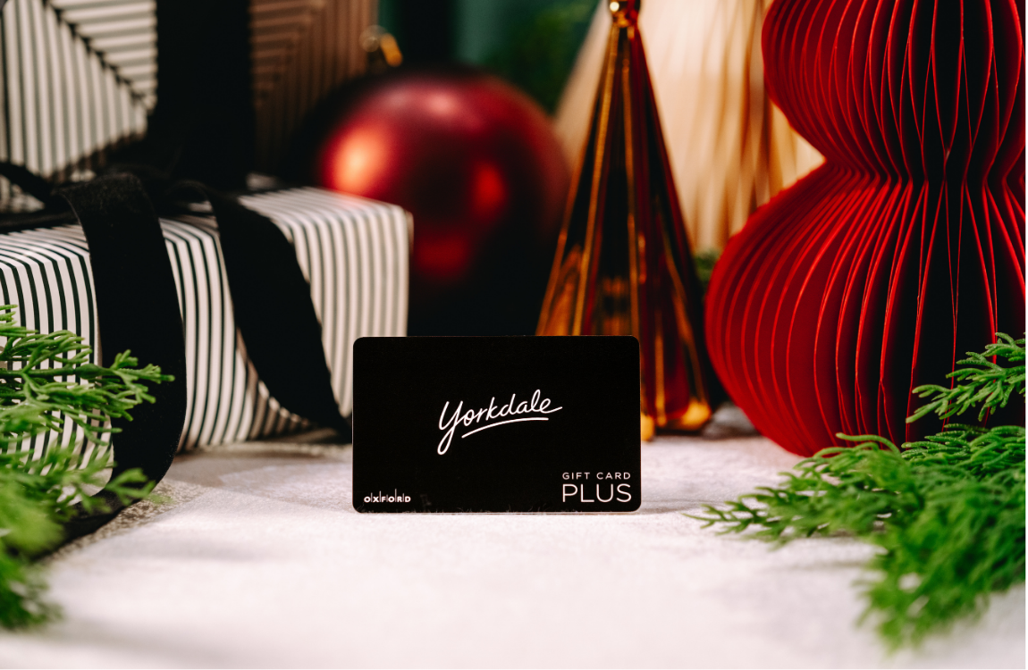 Black gift card with greenery & present