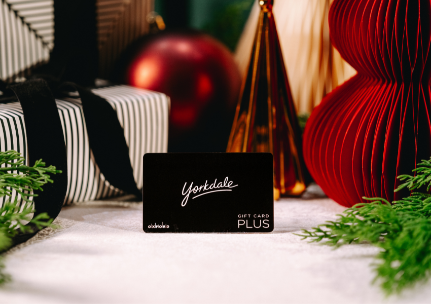 Black gift card with greenery & present